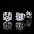 0.5ct Round Brilliant Moissanite Stud Earrings in 925 Sterling Silver on black background